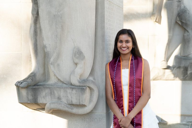 Sejal Gupta stands next to Pylons