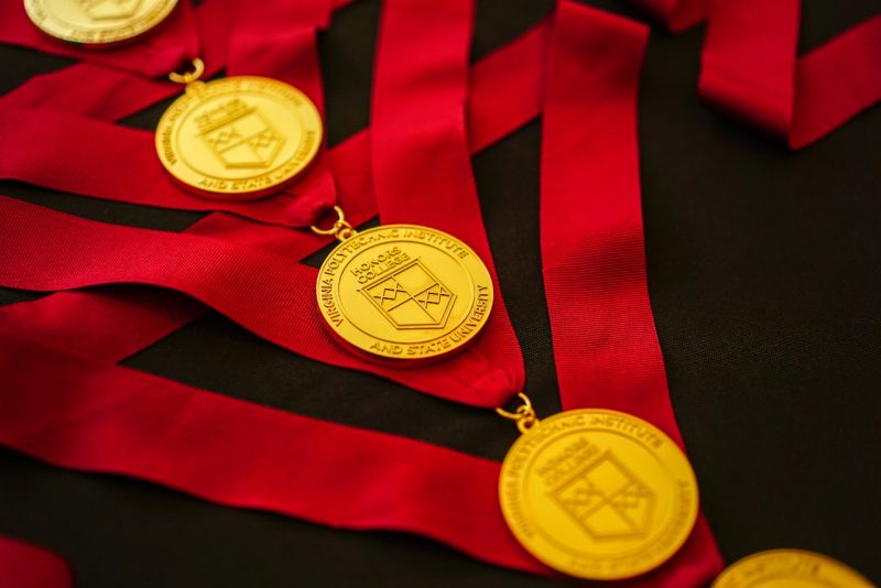 Honors Medallions laid out on black tablecloth.